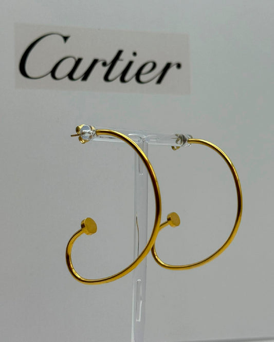 Arete Cartier clavo dorado