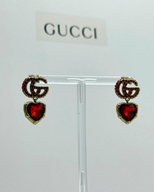 Arete Gucci piedras rojas oro viejo
