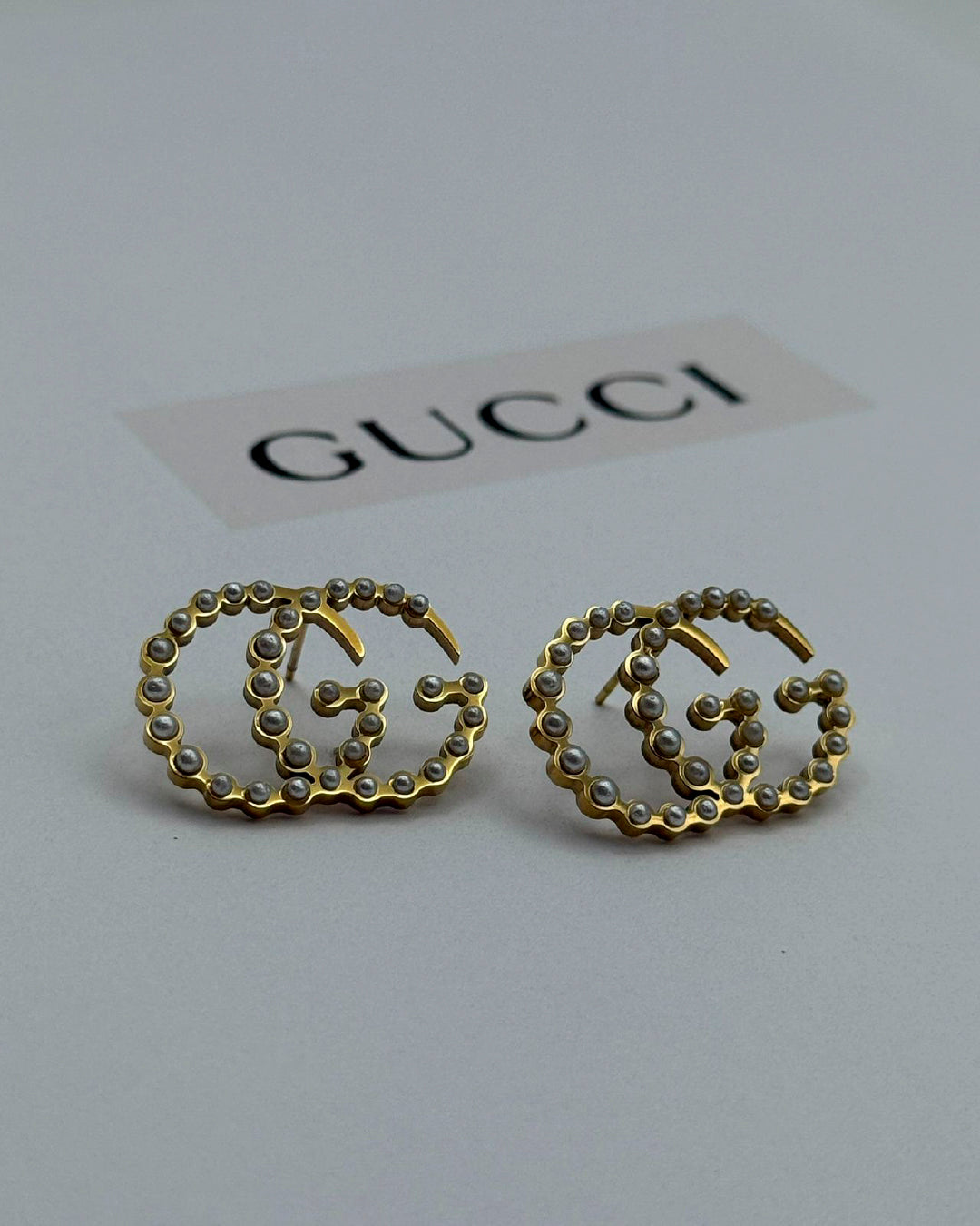 Arete Gucci de perlas con dorado