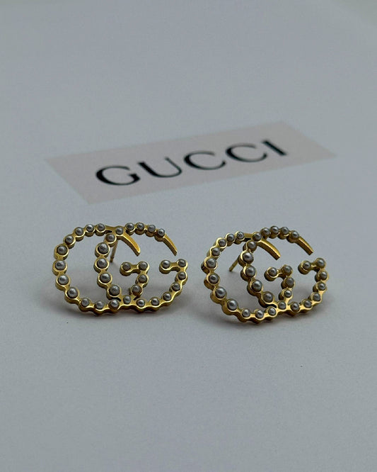 Arete Gucci de perlas con dorado