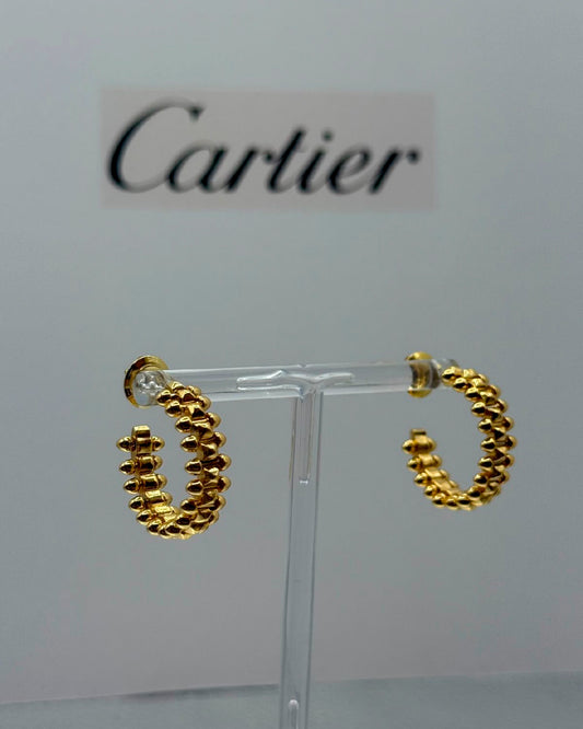 Arete Cartier dorado con picos dorado